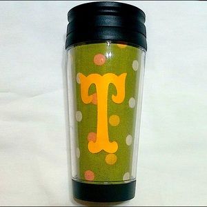 Custom insulated tumbler with initial “T” and colorful polka dots.